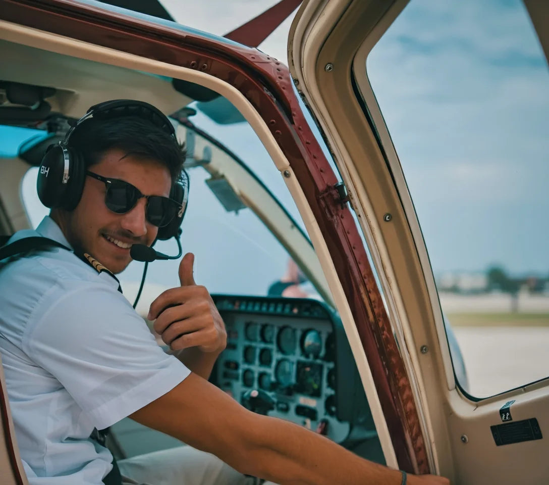 A male pilot is wearing th BH Aviation Headset Alpha Lite